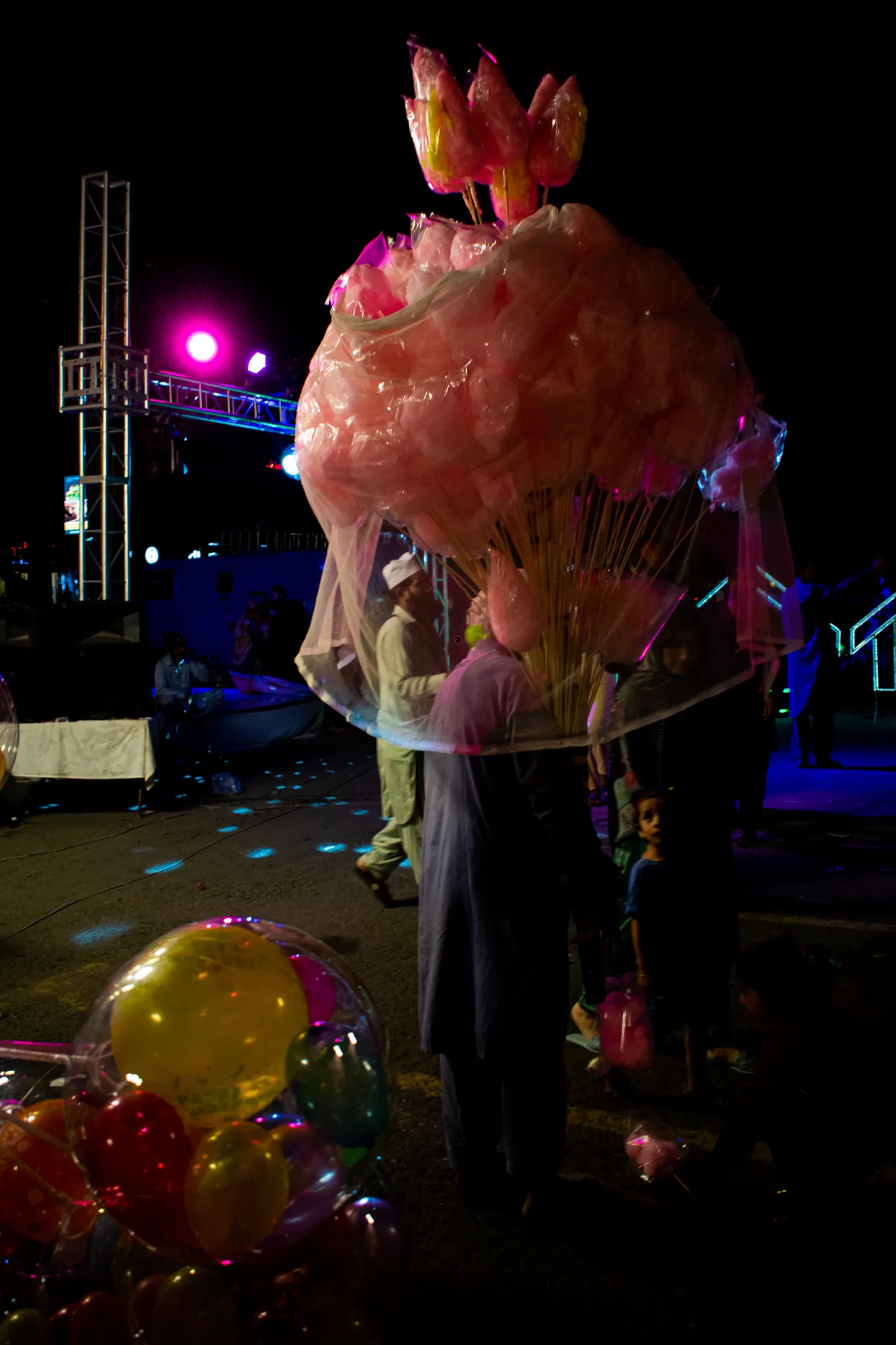 A vendor selling cotton candy during the festivities