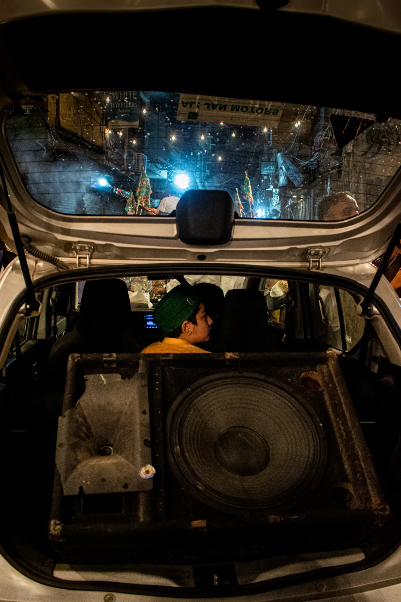Alto’s trunk carrying a loud speaker with naat playing on it