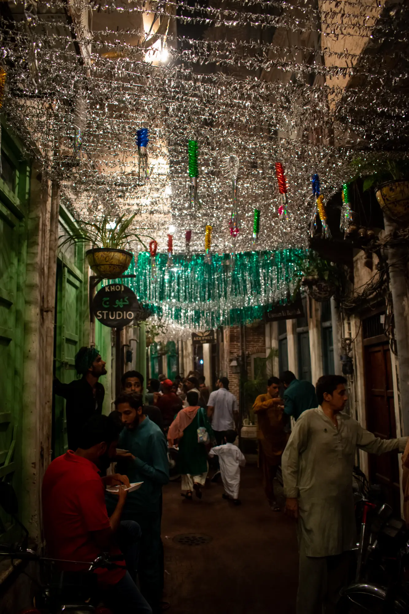 Silver streamers form a sparkling ceiling in the streets on andaroon