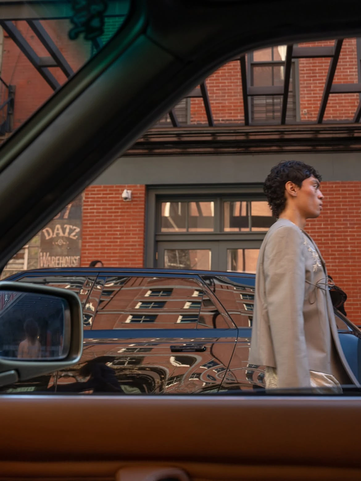 A view from the backseat, framing the runway and visualizing the collection's narrative of being stuck in traffic